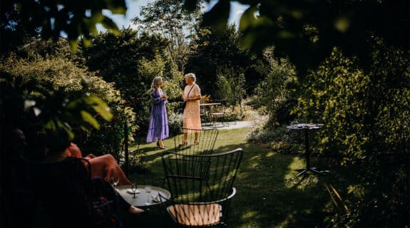 women with cocktails in a garden