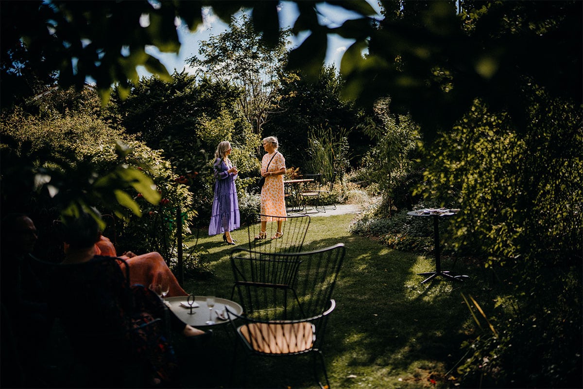 women with cocktails in a garden